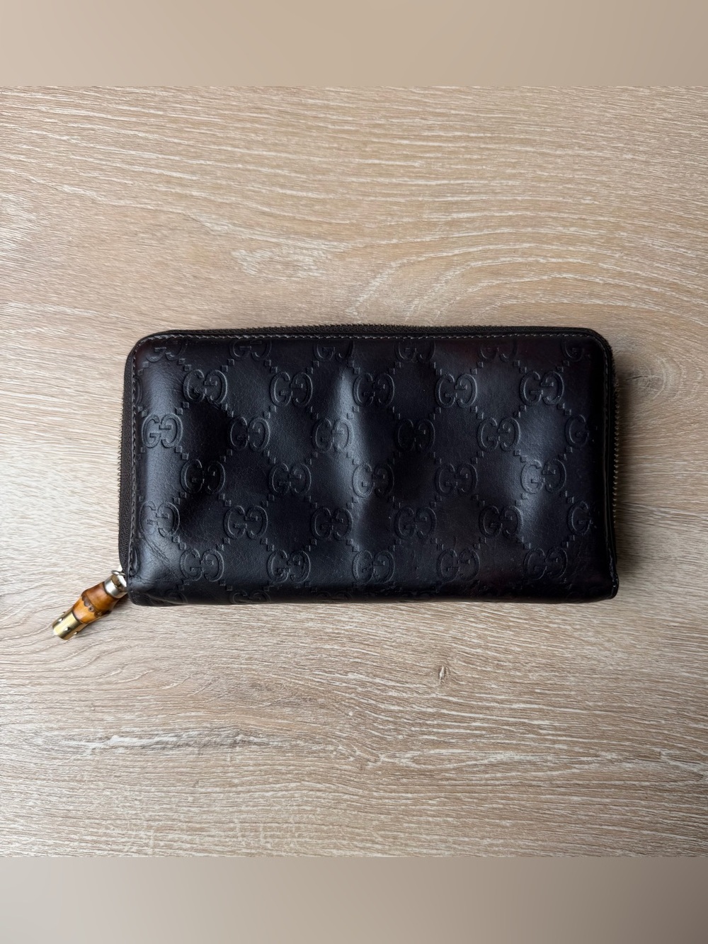 Gucci Dark Brown Embossed GG Zip Wallet with Bamboo Pull